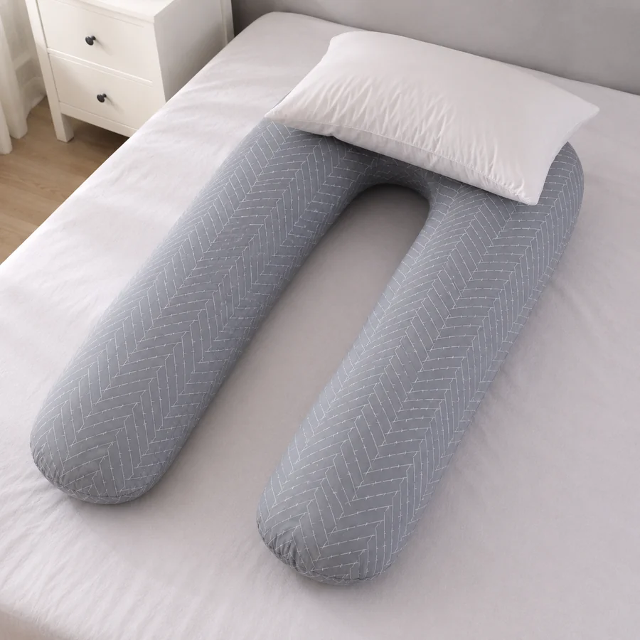 An ordinary head pillow added on top of the U-shape’s curve, making a stack that is visibly too high