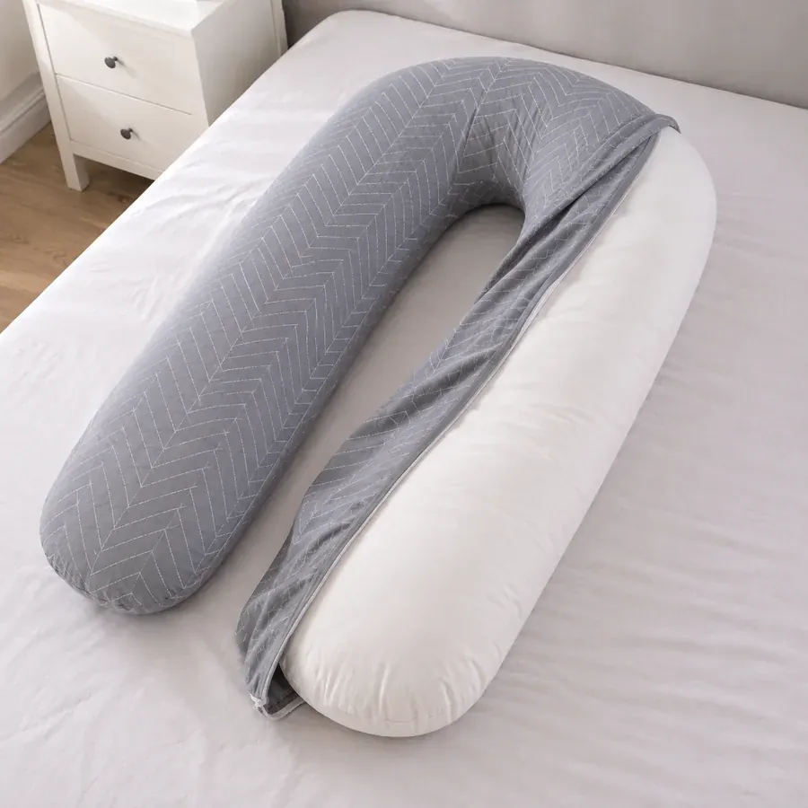 Cover half removed from the pillow, the zip open along its full length